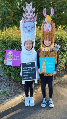 two children wearing llama costumes standing next to each other