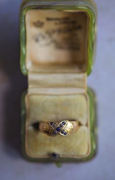 A unique Victorian ring in terms of its design and origin. It has full British hallmarks for gold (18ct gold), date (1894), and origin (Chester). It features small blue sapphires and diamonds set into a thick 18ct gold band. Victorian rings that were made in Chester are scarce in the marketplace because most of the jewellery pieces were made in other Assay Offices, mainly Birmingham. Historically people believed sapphires symbolize truth and faithfulness and keep its owner safe from illness and Victorian Gold Ring, Diamond Sapphire Ring, Antique Style Rings, Pretty Accessories, Victorian Ring, Victorian Gold, Victorian Rings, Sapphire Diamond Ring, Antique Rings