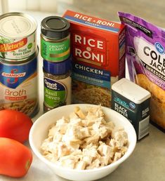 the ingredients for this meal include chicken, rice and tomatoes