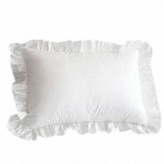 two white pillows with ruffles on them