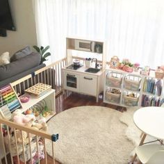 Organised Kids Play Area Idea-this is a simple playpen in our lounge room that I have progressively turned into a mini play room as my daughter got olderStarting small with a rug and a few toys when she was a baby it gradually grew with her through toddlerhoodFeaturing Ikea's children's toy kitchenplay foodEames replica table and chairsjigsaws and many other fun things Large Playroom, Playrooms Ideas, Kids Play Corner, Kid Friendly Living Room, Baby Play Areas, Small Playroom, Play Corner, Toy Room Decor, Living Room Playroom