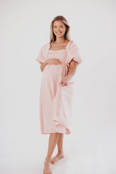 The Hamilton is everything you're looking for in a midi dress - charming, sophisticated, and absolutely flattering. It features premium quality details, like a sweetheart neckline and gorgeous balloon sleeves that can be worn on or off the shoulder. It's an unforgettable choice for every body type, and extra-comfy for expecting mamas! The best part? You can wear this beauty long after your sweet baby arrives! Available in multiple colorways. FIT: Runs true to size. Features a smocked back panel for comfort. This dress is roomy in the waist and will accommodate early maternity in your true size, but consider sizing up if you are in advanced pregnancy. MATERIAL: GARMENT DETAILS: Empire-waisted midi dress, with sweetheart neckline and statement balloon sleeves that can be worn on or off the s Pink Puff Sleeve Midi Dress For Brunch, Pink Puff Sleeve Dress With Sweetheart Neckline For Brunch, Pink Fitted Midi Dress With Balloon Sleeves, Fitted Bodice Midi Dress With Sweetheart Neckline For Brunch, Fitted Maternity Midi Dress, Sweetheart Neckline Midi Dress With Fitted Bodice For Brunch, Pink Midi Dress With Gathered Puff Sleeves, Pink Puff Sleeve Midi Dress For Date Night, Pink Midi Dress With Gathered Sleeves And Square Neck