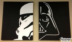 two star wars paintings on the wall in a room with black and white walls, one is