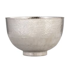 a large silver bowl sitting on top of a table