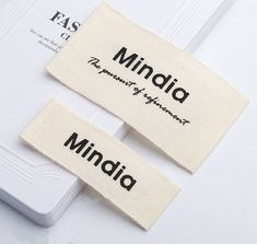 two labels that say mindia and the word's meaning are placed on top of each other