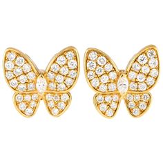 These impeccable earrings will instantly capture your imagination. Each one of these butterfly shaped earrings features an 18k yellow gold setting measuring 0.65 round. Diamonds with a total weight of 1.33 carats allow them to sparkle brightly every time they catch the light.This jewelry piece is offered in brand new condition and includes a gift box. Butterfly Earrings Gold, Diamond Butterfly, Bold Earrings, Butterfly Earrings Stud, Halo Earrings Studs, Yellow Gold Setting, Stylish Earring, Butterfly Shape, Hanging Earrings