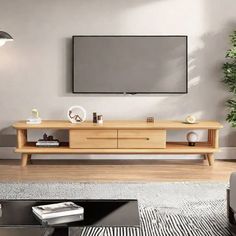 a living room with a large television on the wall