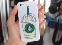 a person holding up a phone case with a starbucks drink on it