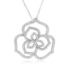 A trio of contrasting white cubic zirconia flowers blossom upon our Wild Flower pendant, arrayed in stylish asymmetry. Freed from tradition, the three different styles of flower bloom with a wild touch, unique down to each delicate petal. All Suzy Levian pendants come with a complimentary 18' chain necklace. This pendant is designed by Suzy Levian with a message. By creating jewelry that is beautiful inside and out, Suzy Levian's message is revealed through a hidden stone set inside the shank of Levian Jewelry, Gemstone Brooch, Cubic Zirconia Bracelet, Cubic Zirconia Necklace, Cubic Zirconia Jewelry, Flower Pendant Necklace, Creating Jewelry, Jewelry Rings Diamond, Gemstone Necklace Pendant