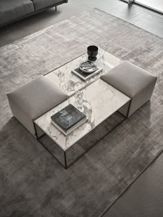 a coffee table sitting on top of a carpet covered floor