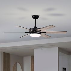 a ceiling fan with three blades in a living room