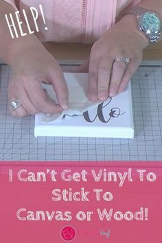 a woman is using a knife to cut out letters on a piece of paper that says, i can't get vinyl to stick to canvas or wood