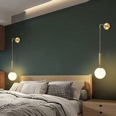 a bedroom with green walls and two lamps on the wall above the bed, next to a night stand