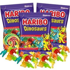 three bags of harbo dinosaur gummy bears next to each other on a white background