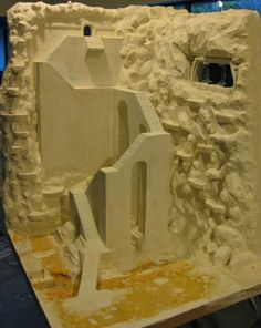 a model of a building made out of clay