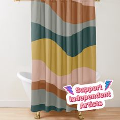 a colorful shower curtain with the words support independent artists on it in front of a bathtub