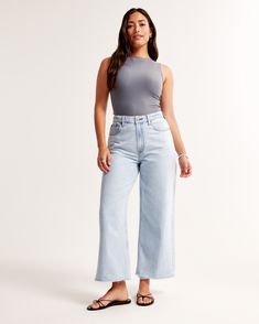 Our Curve Love high rise cropped wide leg jeans in a light wash with a raw-cut hem. This fit features a 10.5” high rise, is relaxed at the waist and hips, and eases into a wide, full-length leg shape with a cropped length. Our Curve Love styles add an additional 2” at the hip and thigh to allow room for your curves and eliminate waist gap. This jean is made from our super light drapey denim fabric, which features a super soft lightweight rigid denim. Female Features, Cropped Wide Leg Jeans, Women's Bottoms, Denim Collection, Extra Room, Pocket Bag, Denim Fabric, Cropped Jeans, Wide Leg Jeans