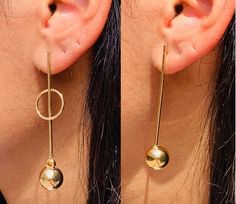 Gold Filled Bar Circle Ball Drop Earrings. Approximately 65mm Long. The perfect pair for a Simple White Tank or Little Black Dress. Material: 18 Karat Gold Filled, Hypoallergenic. Tarnish Resistant. Gold-filled does not de-laminate or peel like Gold plated Jewelry nor does it tarnish as readily as silver. Generally speaking, gold filled is better quality and will have a much longer lasting color than plated jewelry. We recommend keeping abrasive chemicals away from the jewelry for the items to l Long Drop Plug Earrings As Gift, Minimalist Dangle Plug Earrings For Party, Long Drop Hoop Earrings Gift, Drop Linear Earrings For Pierced Ears As A Gift, Trendy Long Drop Earrings For Gifts, Pierced Drop Earrings Danglers As Gift, Pierced Danglers As Gift, Elegant Dangle Earrings With Ear Wire, Elegant Dangling Earrings