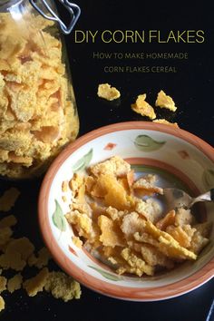 a bowl filled with cornflakes next to a jar