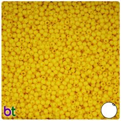 a yellow square made out of small round beads