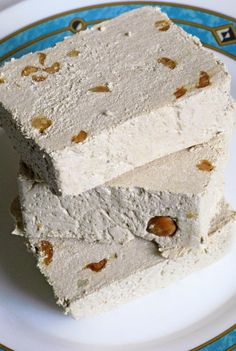 three pieces of cake sitting on top of a white plate