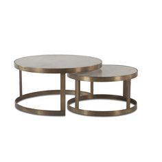 two tables with metal bases and marble tops, one on each table has a circular base