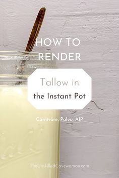 a mason jar filled with yellow liquid next to a white brick wall and wooden spoon