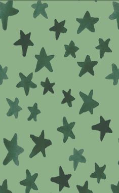 a green background with black stars on it