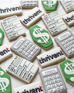 decorated cookies with the words achievement and calculator on them are arranged in rows