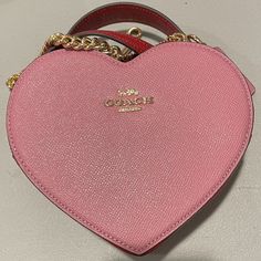 This Listing Is For A Brand New Only Removed From The Package For Photos Coach Purse. It Is A Heart Shaped Purse In Pink And Red Colorblock With A Removable Chain And Leather Strap. This Purse Is Sold Out Everywhere! Tags Still Attached. Amazing Valentine's Day Gift For Anyone!! So Super Cute. Pink Formal Bag For Valentine's Day, Pink Coach Bag For Valentine's Day, Coach Bags For Valentine's Day Gift, Pink Top Handle Bag For Valentine's Day, Coach Heart-shaped Bag For Valentine's Day, Chic Coach Heart-shaped Bag, Luxury Coach Bags For Valentine's Day, Pink Heart-shaped Evening Bag, Designer Red Bags For Valentine's Day