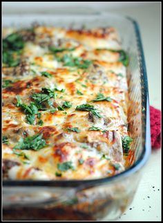 a casserole dish filled with meat and cheese