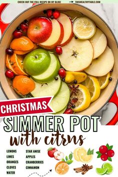 the christmas pot with citruss and apples is shown in front of a recipe book