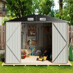 an outdoor storage shed with the doors open and tools in it's center area