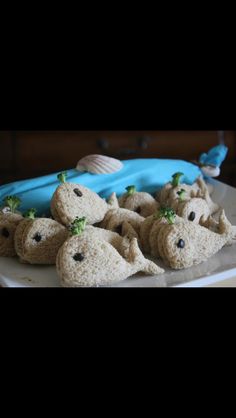 there is a cake made to look like animals on a plate with blue icing