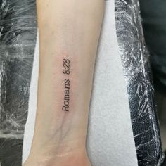 a woman's arm with a tattoo that reads,