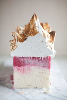 a piece of cake with white and red frosting