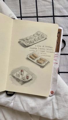 an open book with drawings of pastries and desserts on it's cover