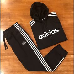 Soft Black Fleece Jogging Suit With Classic Adidas White 3-Stripes. Top Is A Pullover Hoodie With Ribbed Hem And Cuffs, Front Hand Rest Pockets, 3-Stripes Down Each Arm, And An Adidas Spellout Logo On Front. Pants Are Cuffed Hem Joggers With An Elastic/Drawstring Waist, Two Hip Pockets, Adidas Badge Of Sport Logo On Left Thigh, And 3 Stripes Down The Legs. Nwt. Q4x2ss9d Black Adidas Activewear For Jogging, Winter Adidas Activewear With Three Stripes, Adidas Black Sports Joggers, Black Adidas Activewear For Loungewear, Black Fleece Tracksuit For Sports, Black Fleece Sporty Tracksuit, Adidas Black Joggers With Logo, Black Adidas Joggers With Logo, Adidas Black Joggers With Side Stripes