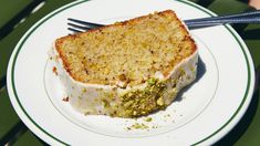 a piece of cake sitting on top of a white plate with a fork in it