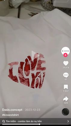 a white shirt with the word love written on it