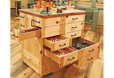 the drawers are open and ready to be used in this workbench or workshop