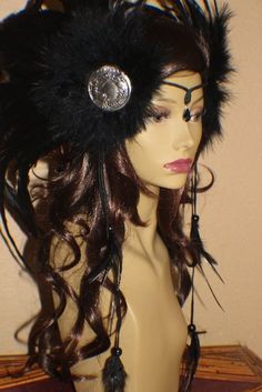 "This listing is for a custom made to order Feather Headdress. Feathers are black iridescent feathers. Headdress is finished with 2 beautiful vintage inspired silver pressed peacock goddess medallions crown has a black crystal accent between the eyes and 2 black suede laces on each side with matching feather accents and black beads that frame the face. SIZE: The feather side plumes will measure around 18'' X 20'' and the black suede leather accent laces with feather ends will measure around 7'' Mystical Black Headpiece For Festivals, Festival Ostrich Feather Trim Headpiece, Festival Headpiece With Ostrich Feather Trim, Ostrich Feather Trim Headpieces For Festivals, Black Bohemian Costume Hats And Headpieces, Handmade Black Festival Headpieces, Adjustable Bohemian Headpieces With Feathers, Bird Headdress, Peacock Goddess