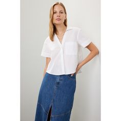 White cotton (100% Cotton). Top. Short sleeves. Collar. Front button closure. 21" from shoulder to hemline. Imported. Fitted Cotton Blouse With Pockets, Casual Cotton Blouse With Button Cuffs, Cotton Blouse With Button Closure For Daywear, Collared Cotton Blouse With Pockets, Cotton Collared Blouse With Pockets, Chic Cotton Tops With Button Closure, Everyday Cotton Blouse With Pockets, Classic Blouse With Pockets For Day Out, Chic Cotton Blouse With Pockets