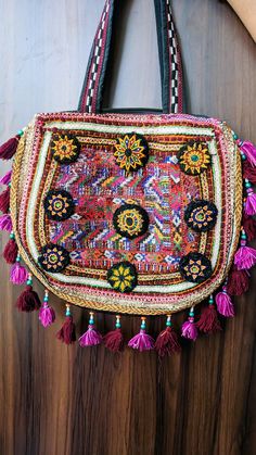 Welcome To our Shop .. Greeting From Laal Bannaji  Banjara Embroidery Bag Are Antique and Vintage Embroidery Work Of Indian Culture And each Piece is on of a kind piece . The products has been crafted by hand by local tribal artist . The shades of color and embroidered cross belt make it more beautiful and suits perfect on any outfits , For night out or a For weekend gateway . This bag is perfect gift for some one and making her day memorable . Material : Cotton Embroidery , seashell , Mirrors P Multicolor Festival Pouch Bag, Festival Multicolor Pouch Bag, Embroidered Hobo Bag Tote For Travel, Embroidered Hobo Tote Bag For Travel, Embroidered Tote Hobo Bag For Travel, Embroidered Tote Bag For Travel, Traditional Multicolor Embroidered Handheld Bag, Traditional Handheld Bag With Multicolor Embroidery, Handmade Multicolor Embroidery Shoulder Bag For Festivals