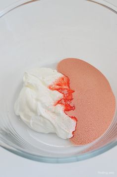 a bowl filled with white and red food