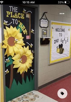 a classroom door decorated with sunflowers and the words welcome to bee