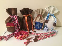 several different types of purses and ties on a table