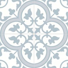 a white and gray tile with an ornate design on the bottom, in different shades