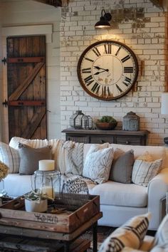 a living room filled with furniture and a large clock mounted to the wall above it