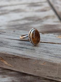 NOTE : WE USED NATURAL GEMSTONES , SO STONE  MAY BE LITTLE DIFFERENT .This  is a listing  of Boho sterling silver ring # Material =  Sterling silver  925 # Gemstone  - Tiger Eye  # Ring Size - Available in all Size # Stone Color - Brown # Stone Shape  - Oval# SKU - 194Handmade Crafting bohemian Ring - This style has bohemian style . it will look beautiful when you wear it ..Thanks for visiting our shop ...  favorite our shop for daily updates ... Bohemian Rings For Everyday Wear, Bohemian Everyday Rings, Adjustable Oval Brown Rings, Adjustable Oval Rings In Brown, Earthy Gemstone Rings For Gift, Earthy Gemstone Rings For Gifts, Earthy Gemstone Rings As Gifts, Rustic Ring Jewelry Gift, Bohemian Amber Sterling Silver Rings